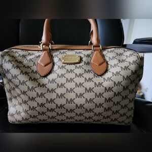 Used Michael Kors satchel.‎ Monogrammed